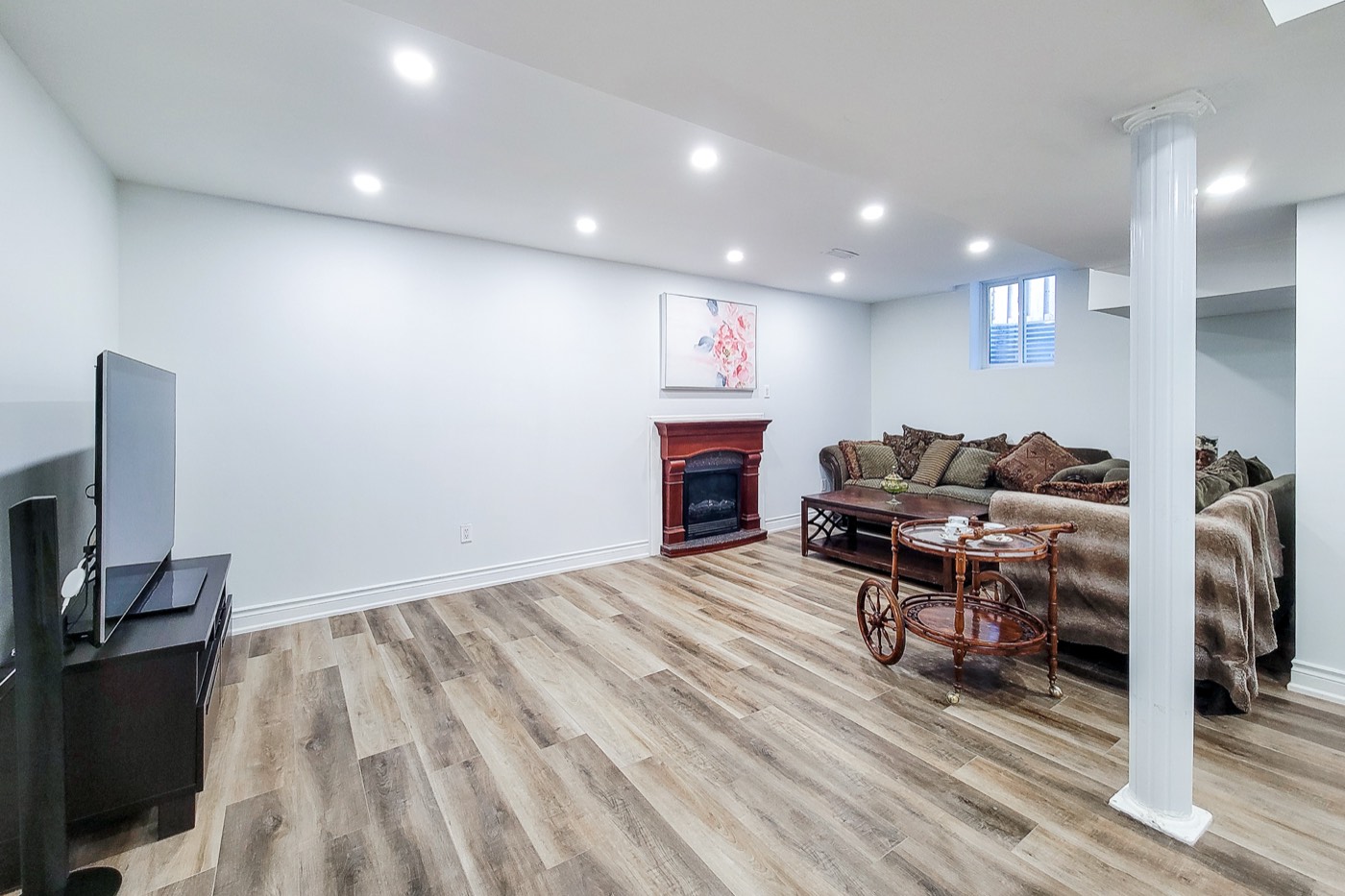 Cleaned basement lounge with fireplace