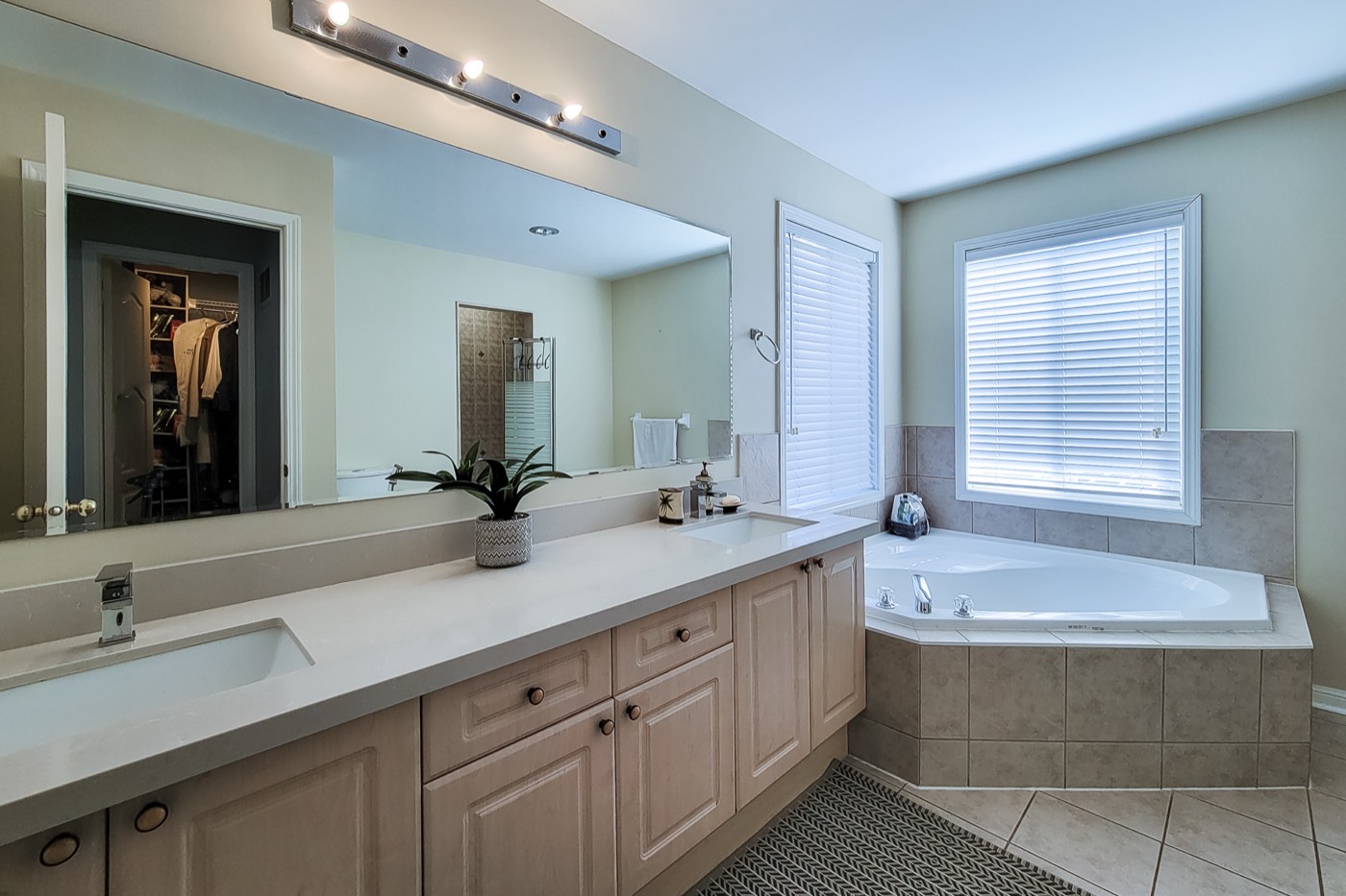 Cleaned ensuite bathroom with double vanity and soaker tub